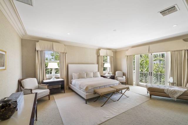 bedroom featuring multiple windows, ornamental molding, access to outside, and french doors