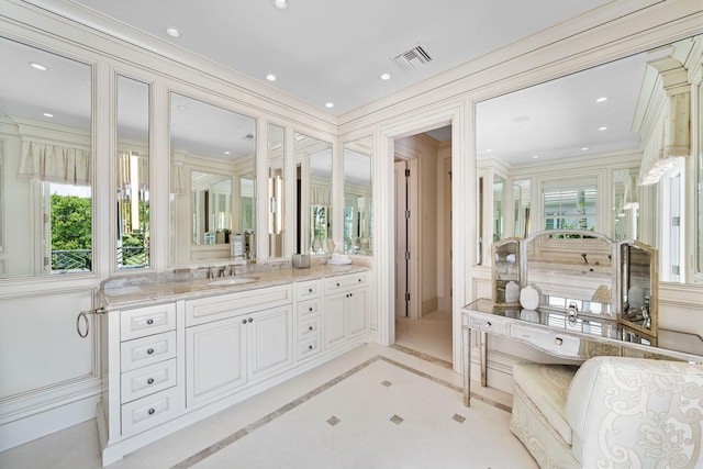 bathroom with tile patterned flooring and vanity