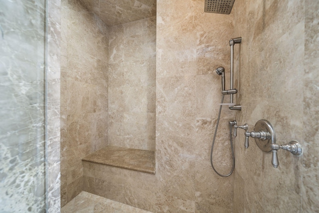 bathroom featuring tiled shower