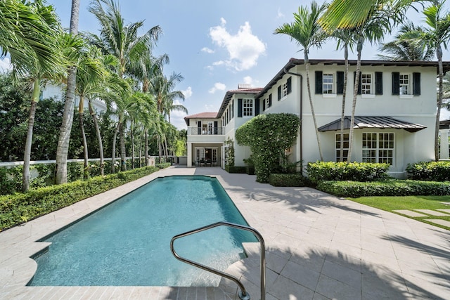 view of swimming pool with a patio