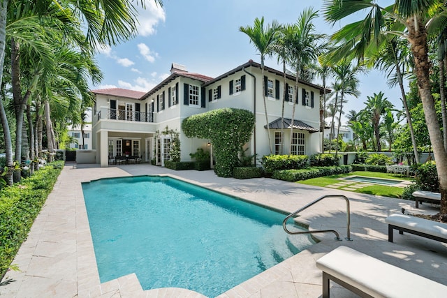 exterior space with a jacuzzi and a patio