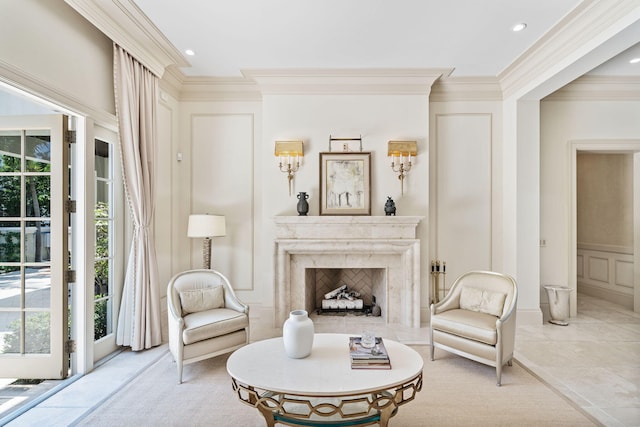 sitting room featuring a premium fireplace and crown molding