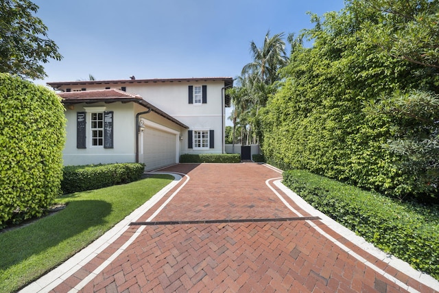 mediterranean / spanish-style home featuring central AC