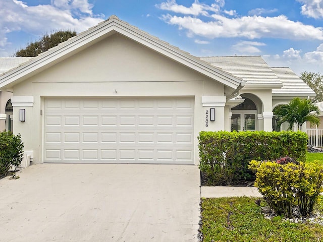 ranch-style house featuring a garage