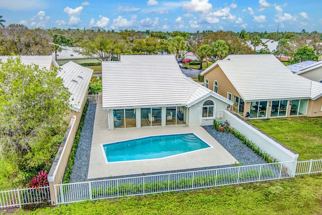 view of swimming pool with a patio area and a lawn