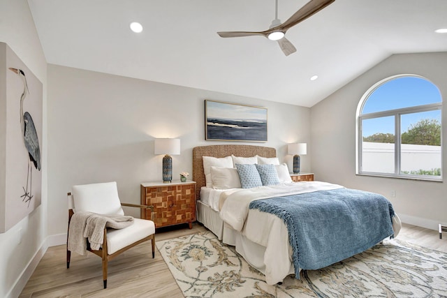 bedroom featuring lofted ceiling, light hardwood / wood-style flooring, and ceiling fan