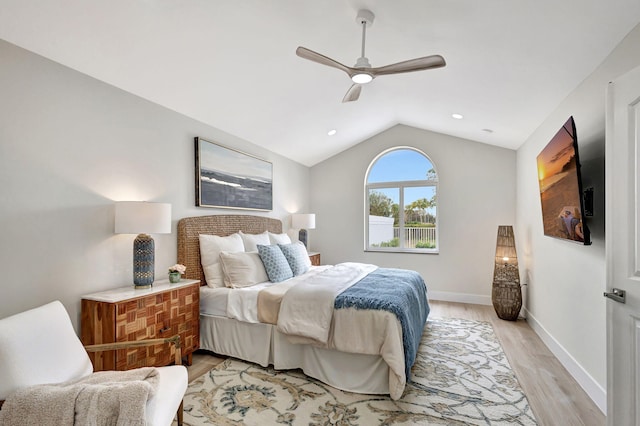 bedroom featuring lofted ceiling, ceiling fan, and light wood-type flooring