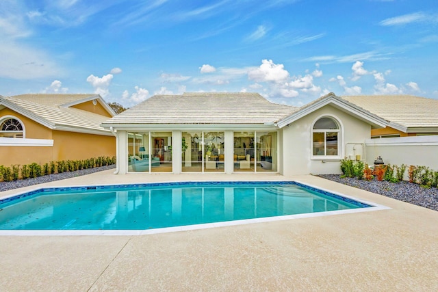 view of swimming pool with a patio area