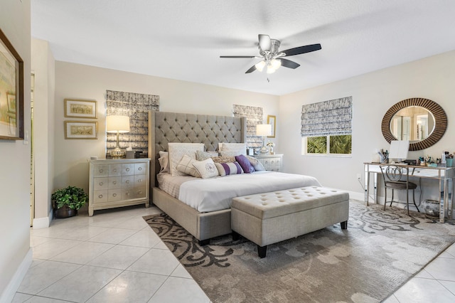 bedroom featuring a textured ceiling, ceiling fan, and light tile patterned flooring