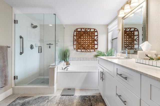 bathroom with vanity, independent shower and bath, and tile patterned flooring