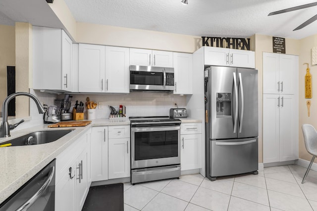 kitchen featuring white cabinetry, sink, and appliances with stainless steel finishes