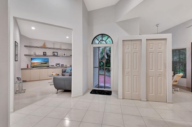 tiled entrance foyer with lofted ceiling