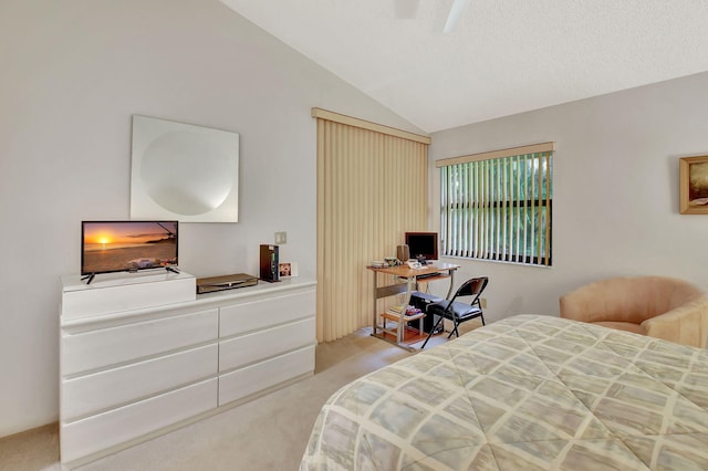 bedroom with vaulted ceiling and light colored carpet