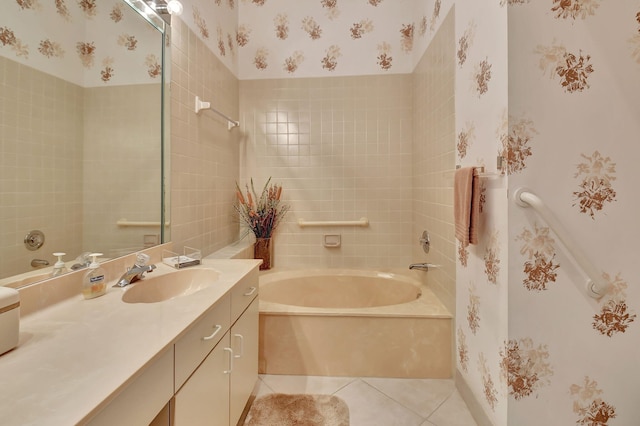 bathroom with a bathtub, tile patterned floors, and vanity