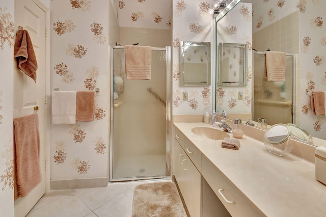 bathroom with tile patterned floors, a shower with door, and vanity