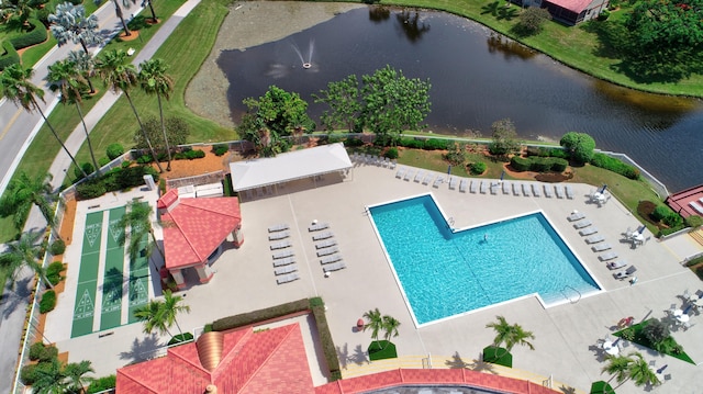 view of swimming pool with a water view