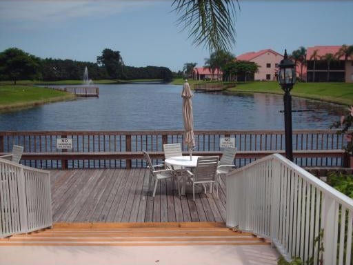 dock area with a deck with water view