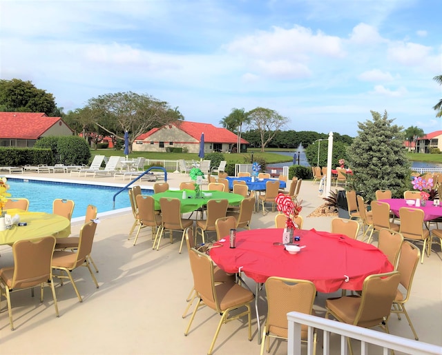 view of swimming pool featuring a patio area