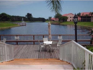 view of dock featuring a deck with water view