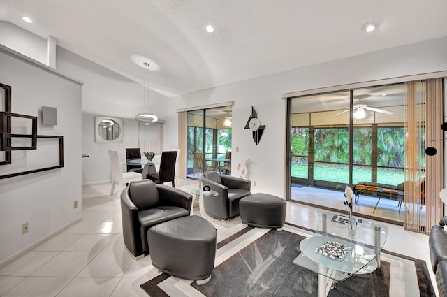 living room featuring light tile patterned floors and ceiling fan