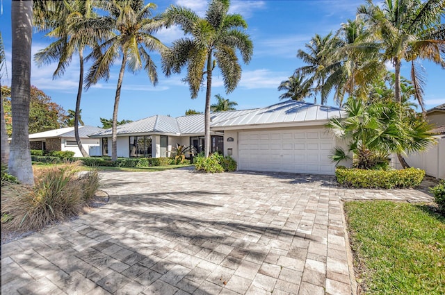 single story home featuring a garage