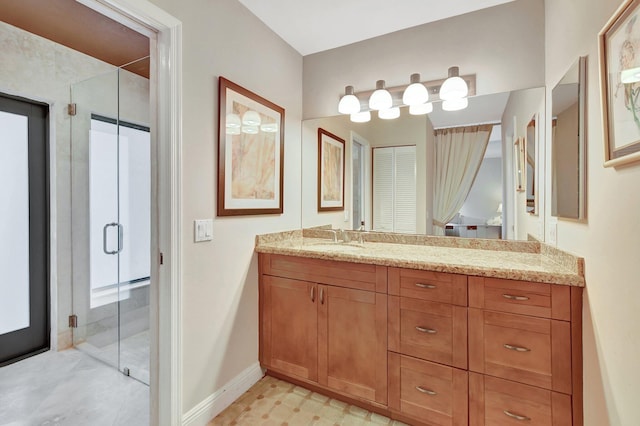 bathroom with vanity and an enclosed shower