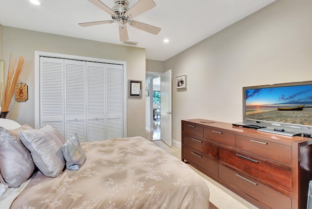 bedroom featuring ceiling fan and a closet