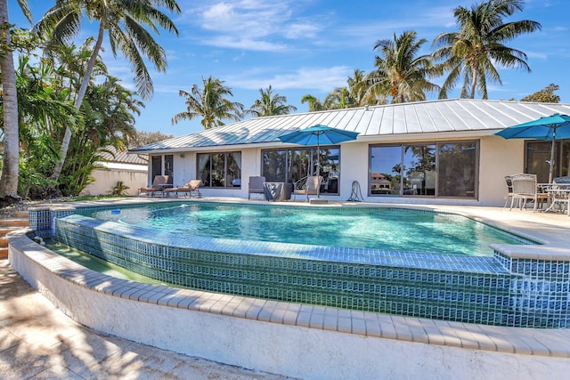 view of pool featuring a patio area