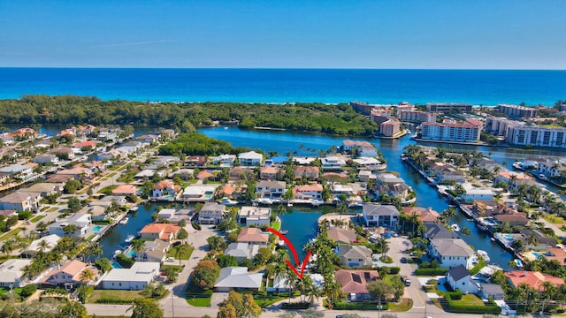 birds eye view of property with a water view