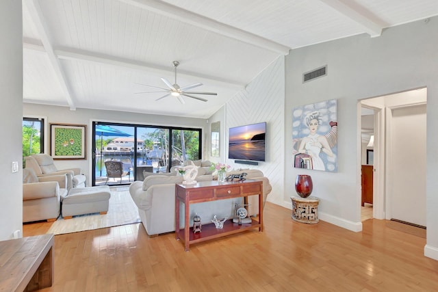 living room featuring ceiling fan, vaulted ceiling with beams, and light hardwood / wood-style floors