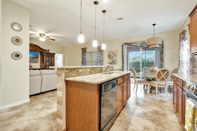 kitchen featuring dishwasher, decorative light fixtures, sink, stainless steel stove, and an island with sink