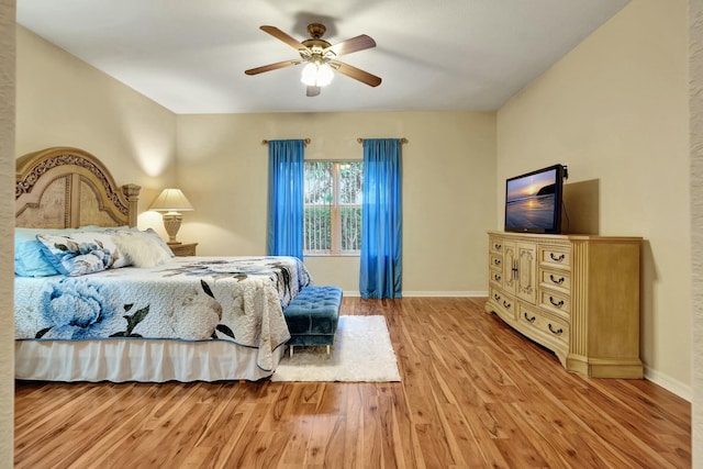 bedroom featuring light wood-type flooring and ceiling fan