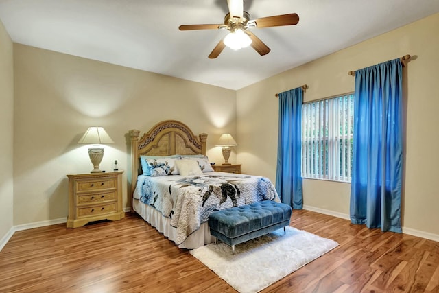 bedroom with ceiling fan and light wood-type flooring