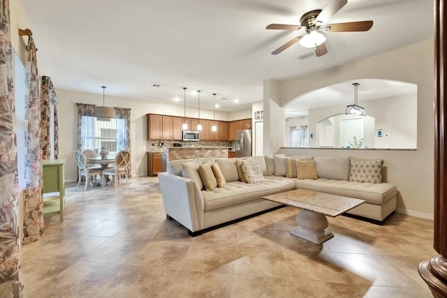 living room featuring ceiling fan