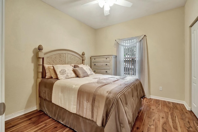 bedroom with ceiling fan and wood-type flooring