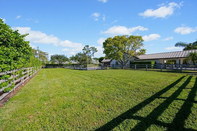 view of yard with a rural view