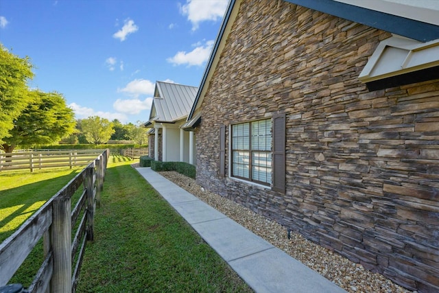 view of home's exterior featuring a yard