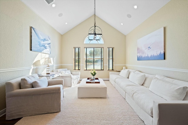 living room with high vaulted ceiling