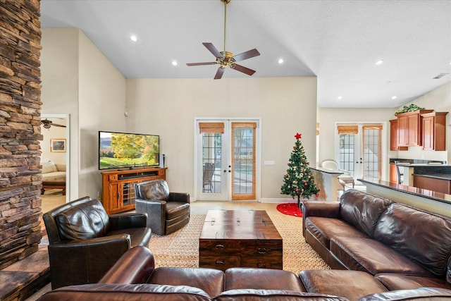 living room with french doors, ceiling fan, and a healthy amount of sunlight