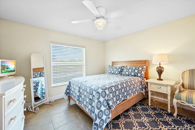 bedroom featuring tile patterned flooring and ceiling fan