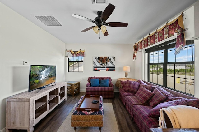 living room with dark hardwood / wood-style floors and ceiling fan