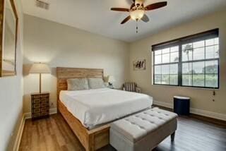 bedroom with hardwood / wood-style floors