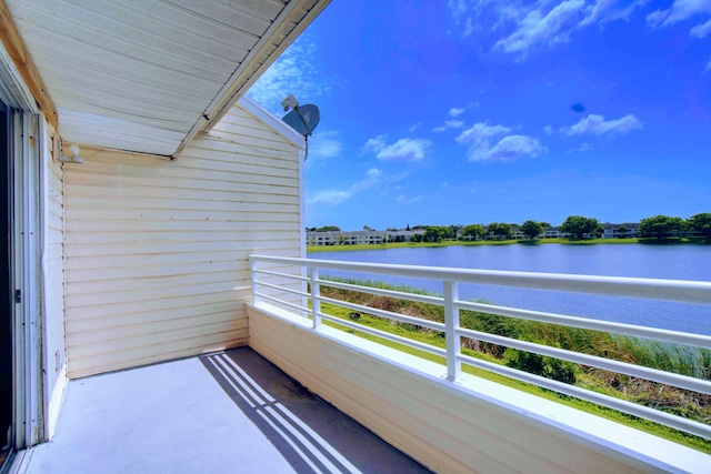 balcony featuring a water view