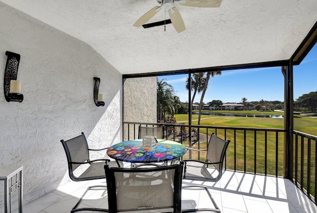 sunroom / solarium with lofted ceiling and ceiling fan