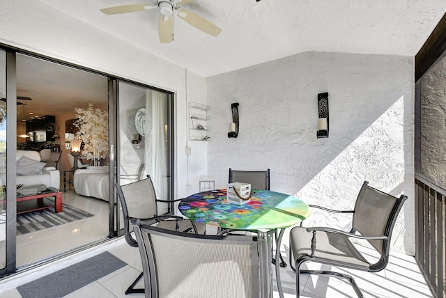 interior space featuring lofted ceiling and ceiling fan