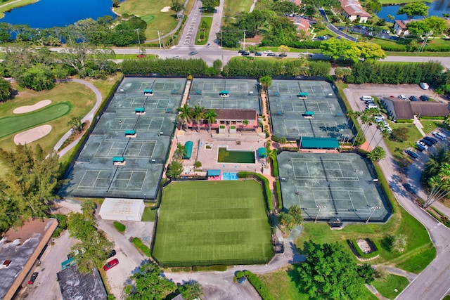 birds eye view of property with a water view