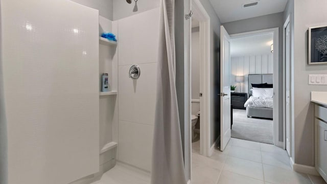 full bath with toilet, a shower with shower curtain, vanity, visible vents, and tile patterned floors