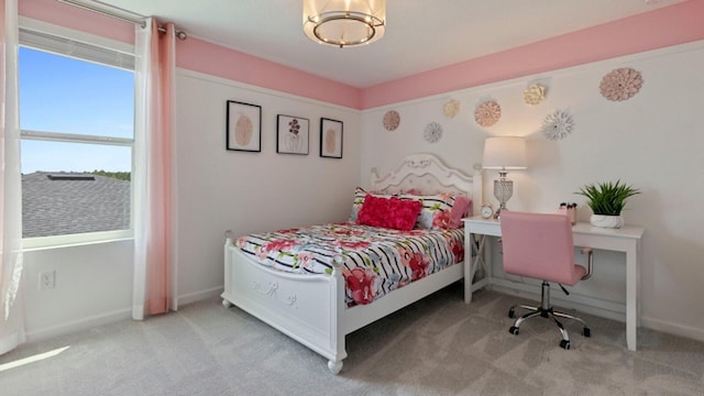 carpeted bedroom featuring baseboards