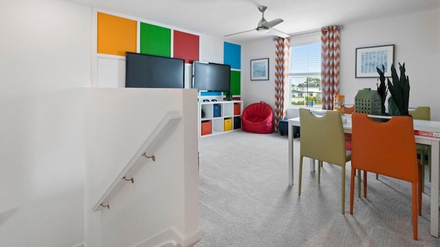 playroom with carpet floors and ceiling fan