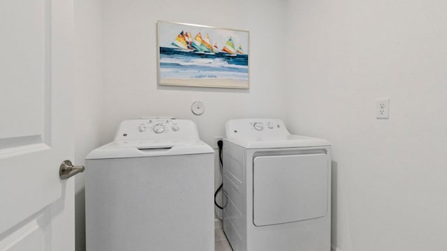 clothes washing area featuring laundry area and independent washer and dryer